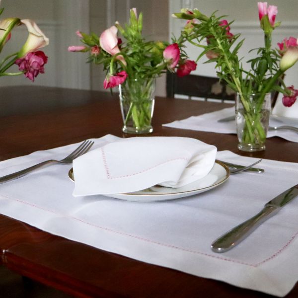 White linen napkins made in the USA with pink stitching. – celina mancurti