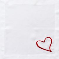 White Italian linen napkin embroidered with a red heart